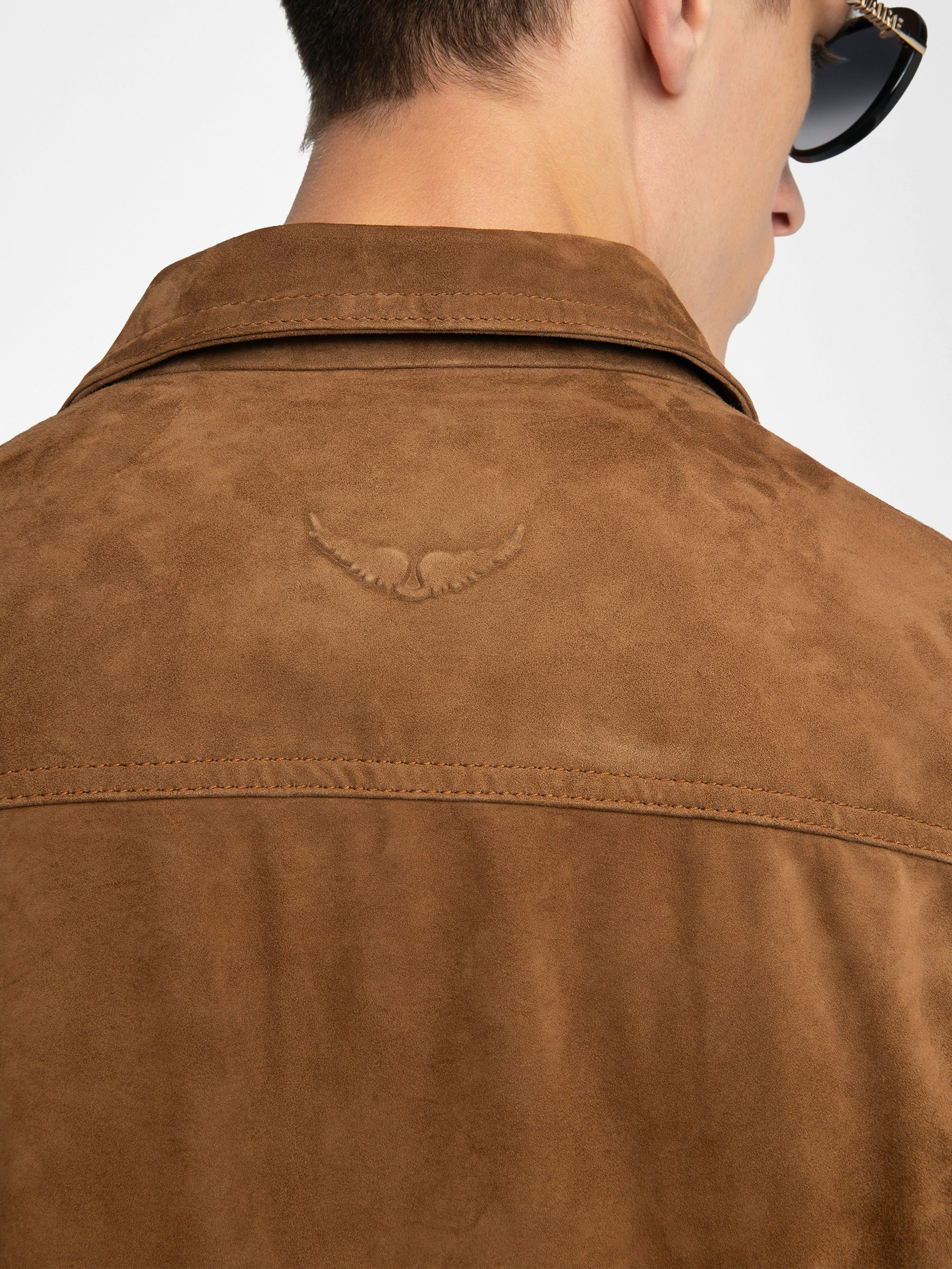 Bases Suede Leather Jacket - Suede jacket with embossed wings on the back, long sleeves and button closure.